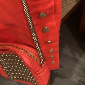 Cute skirt & purse set. Matching gold snaps, both are orange in color.